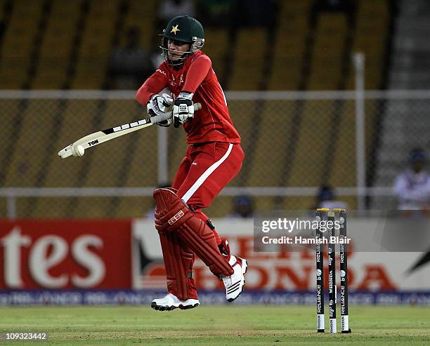 Charles Coventry of Zimbabwe fends off a short ball during the 2011 ICC World Cup Group A match between Australia and Zimbabwe at Sardar Patel...