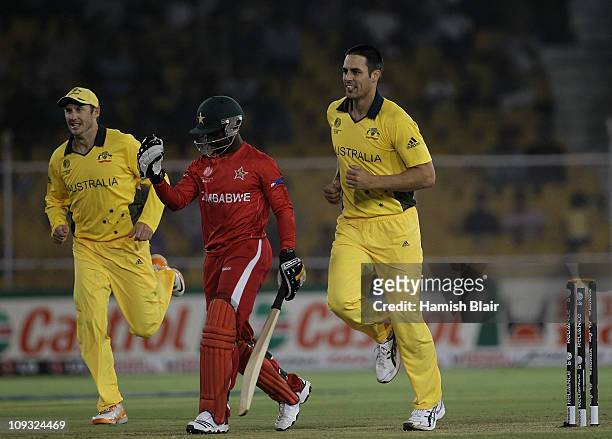 Mitchell Johnson of Australia celebrates the wicket of Tatenda Taibu of Zimbabwe during the 2011 ICC World Cup Group A match between Australia and...