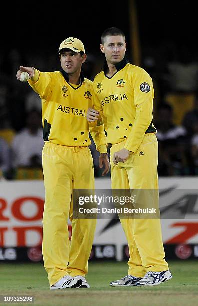 Captain Ricky Ponting and team mate Michael Clarke of Australia set the field during 2011 ICC World Cup Group A match between Australia and Zimbabwe...