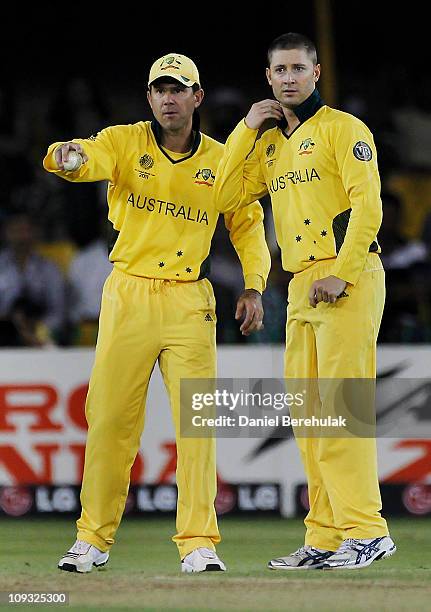 Captain Ricky Ponting and team mate Michael Clarke of Australia set the field during 2011 ICC World Cup Group A match between Australia and Zimbabwe...