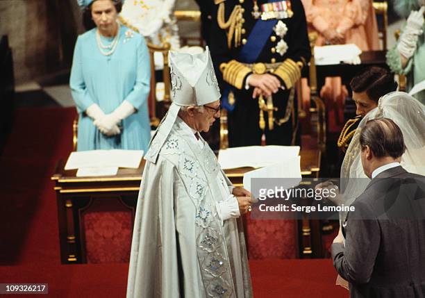 Robert Runcie, the Archbishop of Canterbury officiates at the wedding of Charles, Prince of Wales, and Lady Diana Spencer at St Paul's Cathedral in...