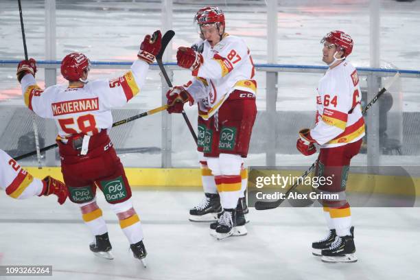 Philip Gogulla of Duesseldorf celebrates his team's second goal with team mates during the DEL Winter Game between Koelner Haie and Duesseldorfer EG...