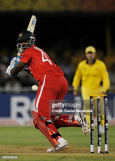 Elton Chigumbura of Zimbabwe plays a leg glance during 2011 ICC World Cup Group A match between Australia and Zimbabwe at the Sardar Patel Stadium on...