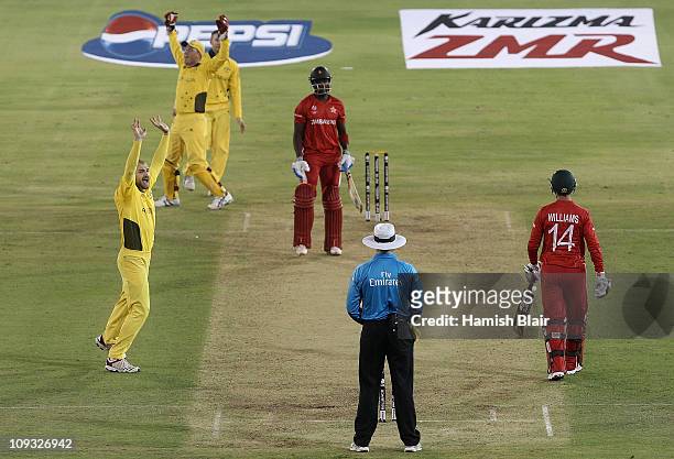 Jason Krejza of Australia celebrates after taking the wicket of Elton Chigumbura of Zimbabwe during the 2011 ICC World Cup Group A match between...