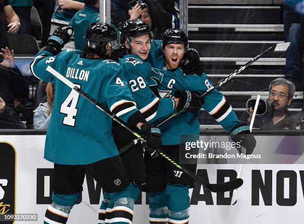 Brenden Dillon, Timo Meier and Joe Pavelski of the San Jose Sharks celebrate scoring a goal against the Arizona Coyotes at SAP Center on February 2,...