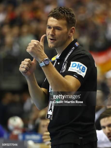 Christian Prokop, head coach of Germany gives the thumbs up during the 26th IHF Men's World Championship group A match between Germany and Brazil at...