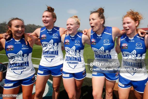 Kangaroos players sing the team song during the 2019 NAB AFLW Round 01 match between the North Melbourne Tasmanian Kangaroos and the Carlton Blues at...