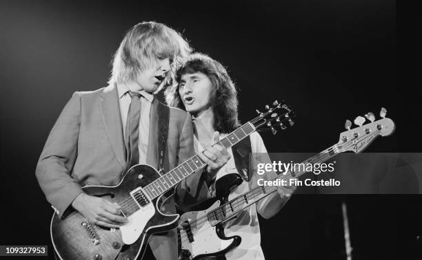 Photo of RUSH, L-R: Alex Lifeson and Geddy Lee performing live onstage on Exit...Stage Left tour at Wembley Arena in London on November 04 1981.