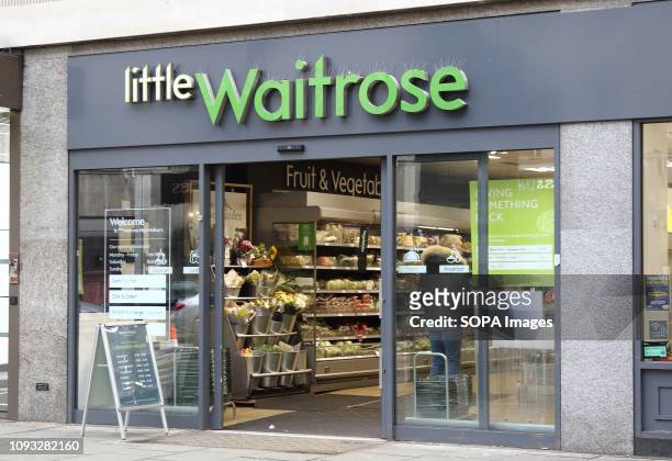 Waitrose shop and brand logo seen in London, UK.