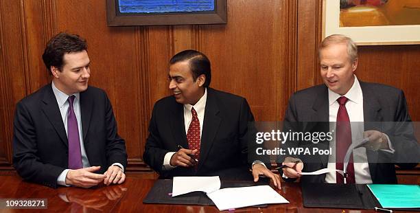 Chancellor George Osborne, Mukesh Ambani, Chairman and Managing Director of Reliance Industries, and Robert Dudley, CEO of BP, during a signing...