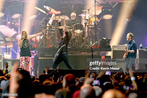 Taylor Hawkins, Dave Grohl, Roger Taylor and Nate Mendel perform onstage at DIRECTV Super Saturday Night 2019 at Atlantic Station on February 2, 2019...