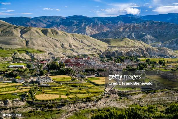 Panoramic aerial view on the town, the agricultural surroundings and the barren landscape of Upper Mustang.