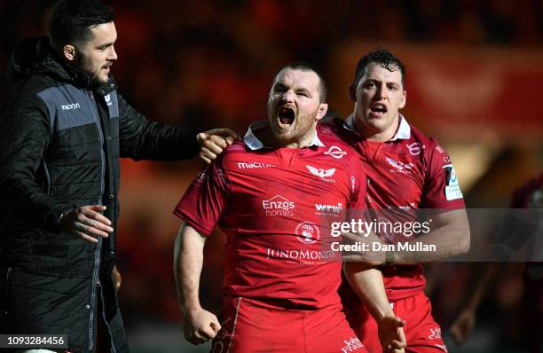 Ken Owens of Scarlets celebrates after scoring his side's second try during the Champions Cup match between Scarlets and Leicester Tigers at Parc y...