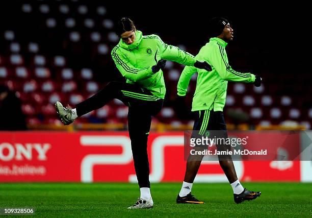 Fernando Torres and Didier Drogba of Chelsea participate in a training session the day before the UEFA Champions League round of 16 first leg match...