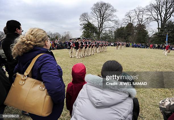 Men dressed as Continental Army soldiers demonstrate a "fight during revolutionary war" as they celebrate George Washington's birthday at Mount...