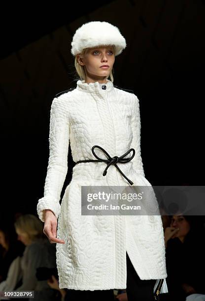 Model walks the runway at the Burberry Prorsum show during London Fashion Week Autumn/Winter 2011 at Kensington Gardens on February 21, 2011 in...