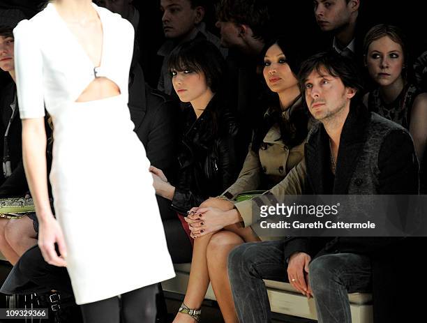 Daisy Lowe, Gemma Chan and Carl Barat attend the Burberry Prorsum Show at London Fashion Week Autumn/Winter 2011 at Kensington Gardens on February...