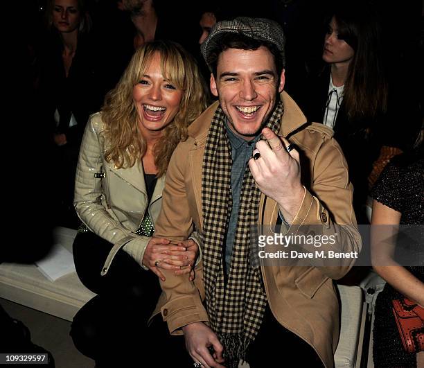 Laura Haddock and Sam Claflin attend the Burberry Prorsum Show at London Fashion Week Autumn/Winter 2011 at Kensington Gardens on February 21, 2011...