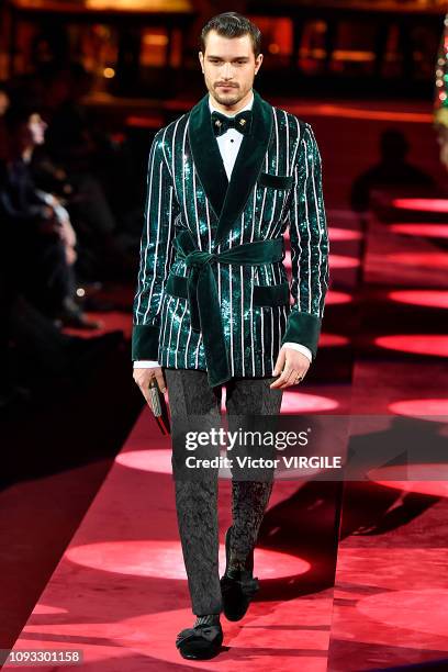 Model walks the runway at the Dolce & Gabbana fashion show during Milan Menswear Fashion Week Autumn/Winter 2019/20 at Metropol on January 12, 2019...