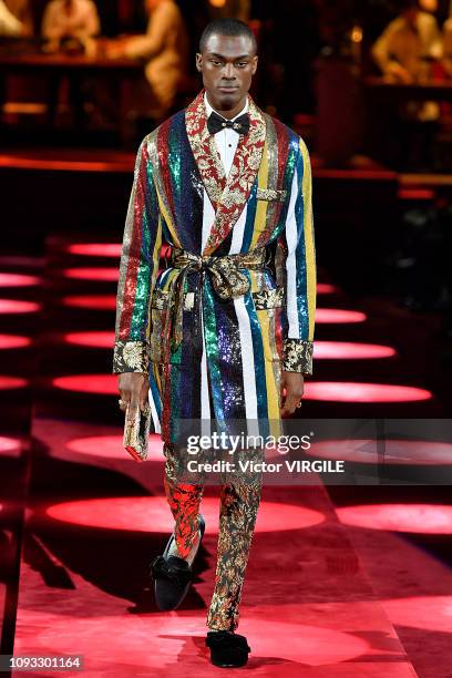 Model walks the runway at the Dolce & Gabbana fashion show during Milan Menswear Fashion Week Autumn/Winter 2019/20 at Metropol on January 12, 2019...