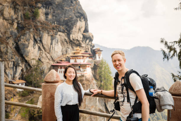 taking photos at the tiger's nest monastery - bhutan tourist stock pictures, royalty-free photos & images