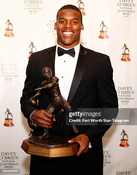 Auburn quarterback Cam Newton speaks at a press conference after being awarded with the winner of the 2010 Davey O'Brien Award at the Fort Worth...