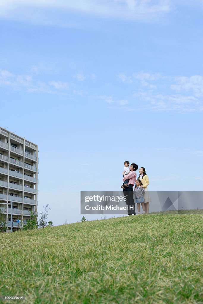 Family who stops in meadow