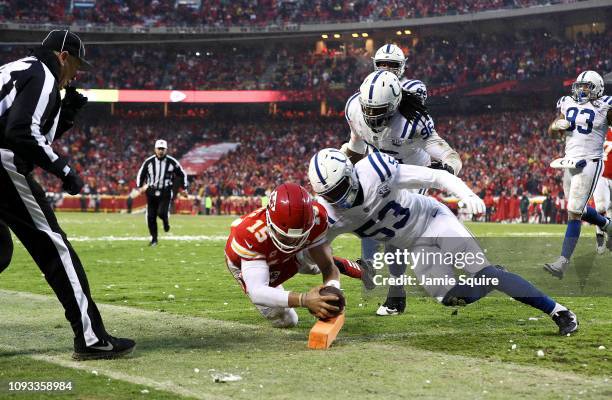 Patrick Mahomes of the Kansas City Chiefs dives for the endzone to for a touchdown as Darius Leonard of the Indianapolis Colts defends during the AFC...