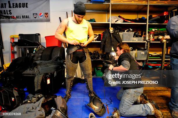 Knights apply armour during a chapter war match between the Nashua Nightmares and the Manchester Monarchs at the Armored Combat league Arena,...