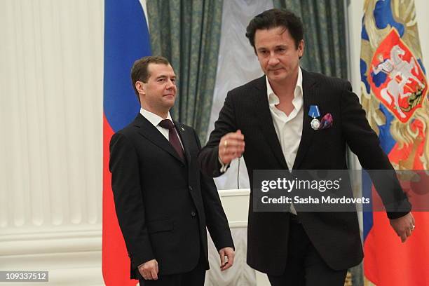 Russian President Dmitry Medvedev looks to actor Oleg Menshikov during an awarding ceremony at The Kremlin on February 21, 2011 in Moscow, Russia....