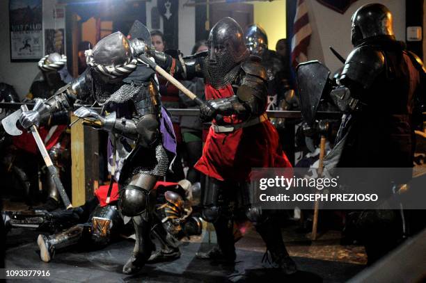 Knights on the Nashua Knightmares battle with the Manchester Monarchs during a chapter war match at the Armored Combat league Arena, Knight's Hall,...