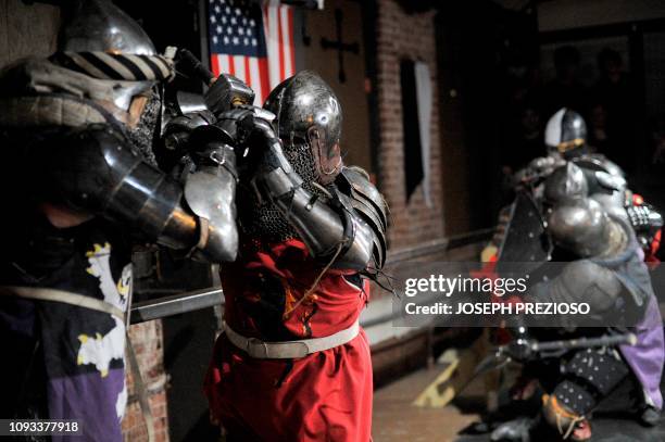 Knights on the Nashua Knightmares battle with the Manchester Monarchs during a chapter war match at the Armored Combat league Arena, Knight's Hall,...