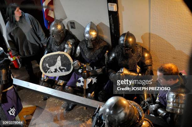 The Manchester Monarchs sit on their bench waiting for the next match during a chapter war match between the Knights on the Nashua Knightmares and...
