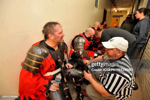 League owner and knight himself, Jay Brookes Sr. Talks to the referee as the knights rest between fights during a chapter war match between the...