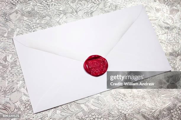 white envelope with red wax seal - wachs stock-fotos und bilder