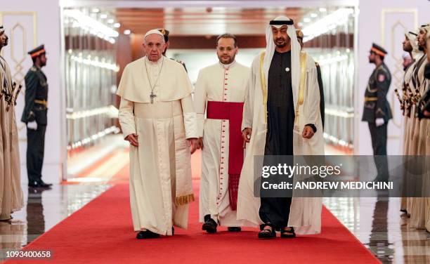 Pope Francis is welcomed by Abu Dhabi's Crown Prince Sheikh Mohammed bin Zayed al-Nahyan upon his arrival at Abu Dhabi International Airport in the...