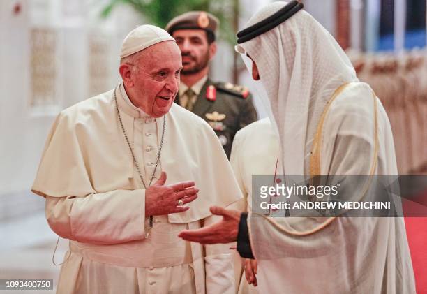 Pope Francis is welcomed by Abu Dhabi's Crown Prince Sheikh Mohammed bin Zayed al-Nahyan upon his arrival at Abu Dhabi International Airport in the...