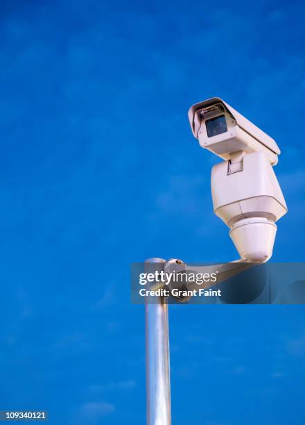 security camera on post. - pole stock pictures, royalty-free photos & images