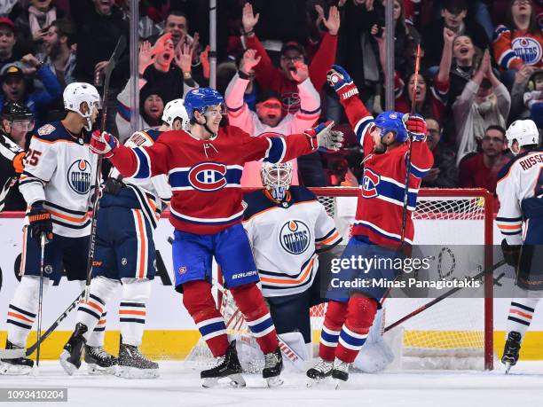 Jesperi Kotkaniemi of the Montreal Canadiens celebrates a third period goal with teammate Tomas Tatar against the Edmonton Oilers during the NHL game...
