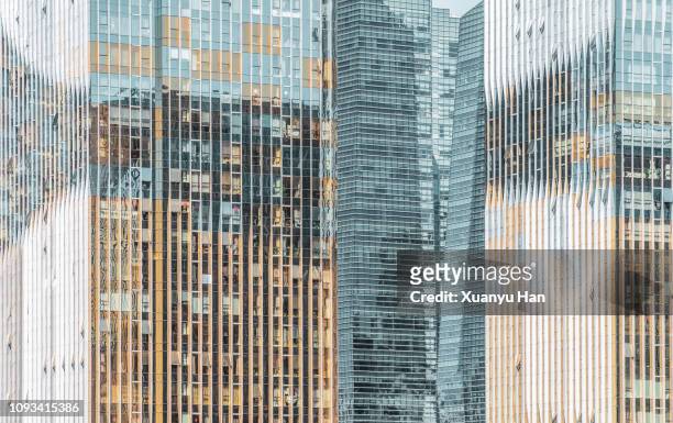 glass windows of modern skyscraper - buildings side by side stock pictures, royalty-free photos & images