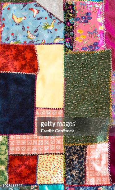 a traditional hand-embroidered quilt - quilted stockfoto's en -beelden