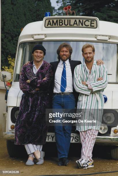 From left to right, actor Timothy Dalton, singer and songwriter Barry Gibb and actor Anthony Edwards on the set of the film 'Hawks', 1988. Gibb, a...