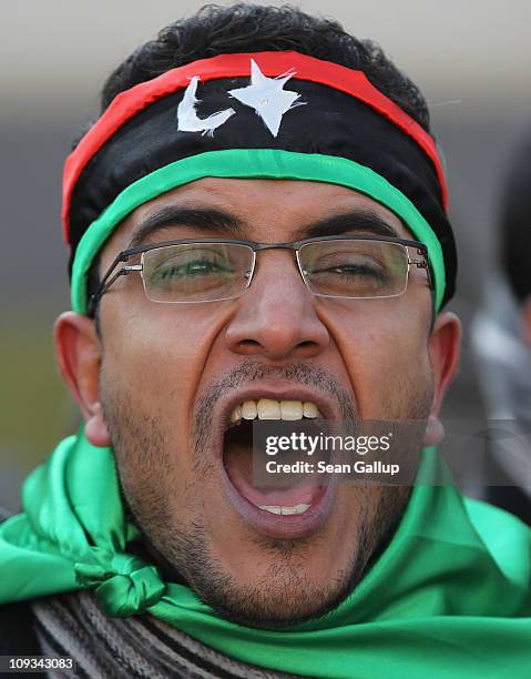 Demonstrators protest against the regime of Libyan leader Moammar Gadhafi outside the Libyan embassy on February 22, 2011 in Berlin, Germany....