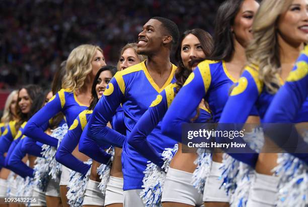 Los Angeles Rams cheerleader Quinton Peron looks on during Super Bowl LIII against the New England Patriots at Mercedes-Benz Stadium on February 3,...