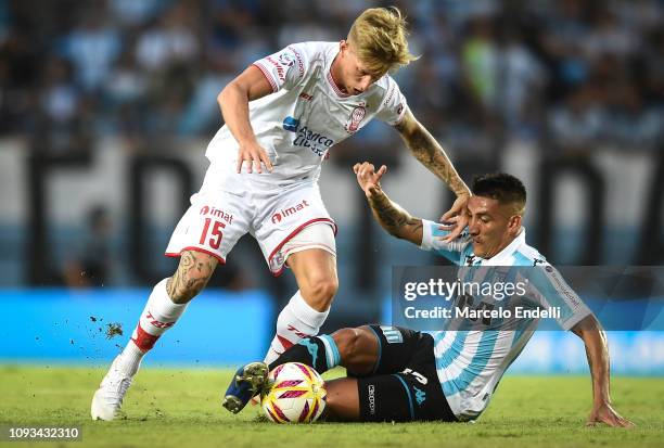 Ricardo Centurion of Racing Club fights for the ball with Ivan Rossi of Huracan during a match between Racing Club and Huracan as part of Superliga...