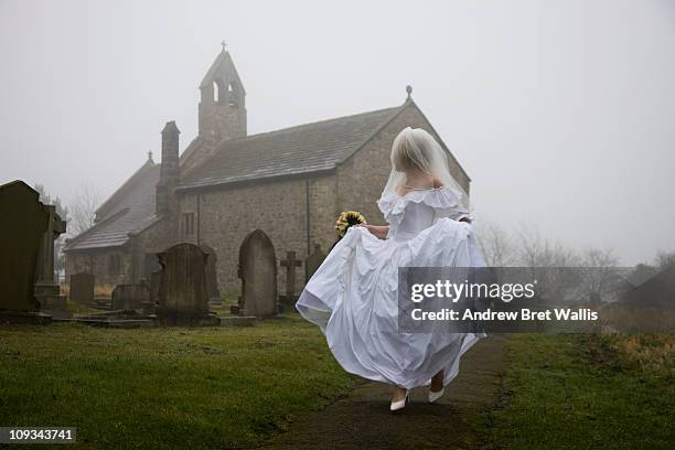 bride running away from a church - runaway 個照片及圖片檔