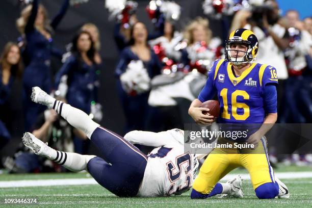 Kyle Van Noy of the New England Patriots sacks Jared Goff of the Los Angeles Rams in the first half during Super Bowl LIII at Mercedes-Benz Stadium...