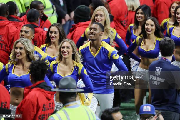 Los Angeles Rams cheerleaders Napoleon Jinnies and Quinton Peron look on during Super Bowl LIII against the New England Patriots at Mercedes-Benz...