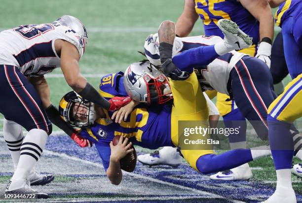 Jared Goff of the Los Angeles Rams is sacked in the first half during Super Bowl LIII against the New England Patriots at Mercedes-Benz Stadium on...