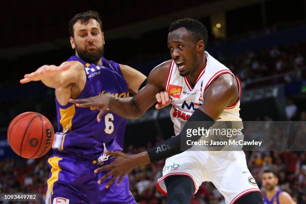 Andrew Bogut of the Kings and Cedric Jackson of the Hawks compete for the ball during the round 13 NBL match between the Sydney Kings and the...
